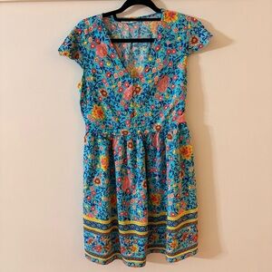 Bright Turquoise Floral Romper with Colorful Blooms